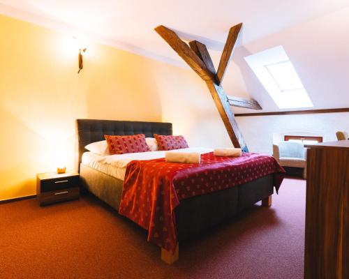 a bedroom with a bed in a room at Elzet penzion in Třeboň