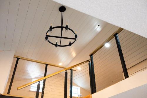 a chandelier hanging from the ceiling in a building at Shares Loft Luxury Apt - NEW! in Rockledge