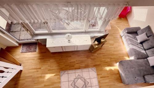an overhead view of a living room with a couch at Seestern in Uhldingen-Mühlhofen