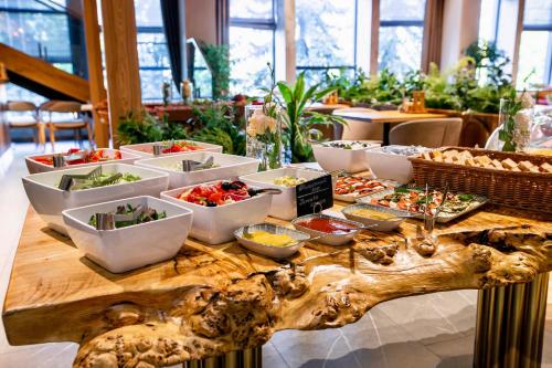 a table with bowls of food on top at Apartel Uzhhorod in Uzhhorod