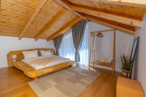 Postel nebo postele na pokoji v ubytování Vidis Chalet Boutique Hotel