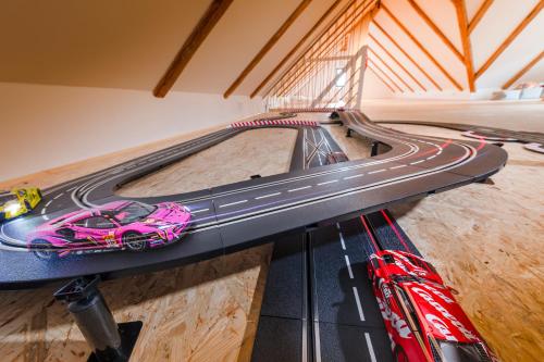 a toy car on top of a track in a room at Chalupa Libverda in Lázně Libverda