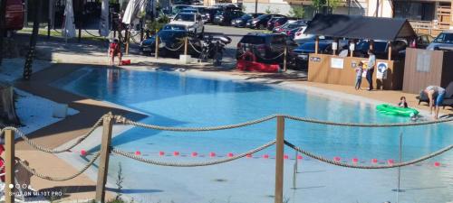 a large swimming pool with a rope around it at APARTAMENT w PLATINUM MOUNTAIN Z PARKINGIEM in Szklarska Poręba