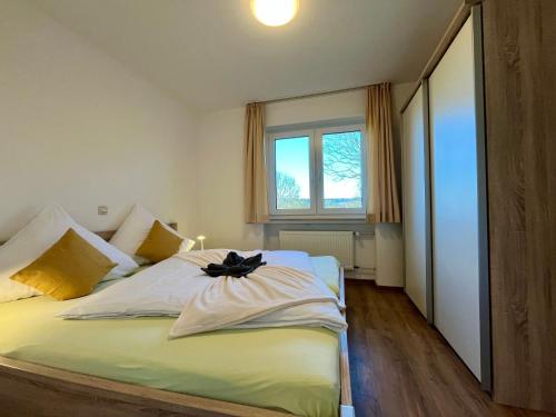 Postel nebo postele na pokoji v ubytování Aparthotel Tannenhof
