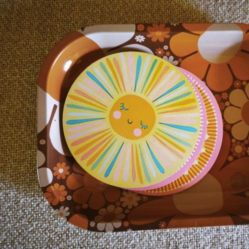 a paper plate with a smiling sun on it at sonnberg in Ischgl
