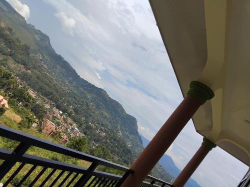 a view of a valley from a balcony at Sweetland view hotel in Lushoto