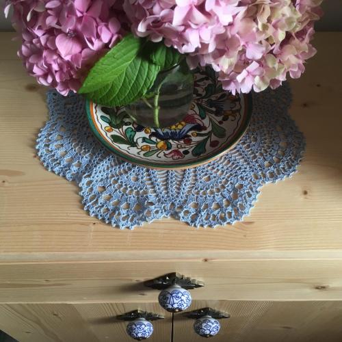 a vase filled with flowers sitting on top of a table at Casa di Nonno Tilio in Priola
