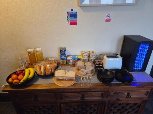 a table with fruit and other food items on it at St aubyn arms Hotel in Praze an Beeble