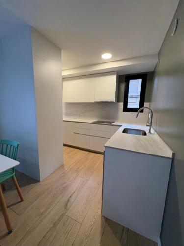 Kuchyňa alebo kuchynka v ubytovaní REUSIA Apartaments