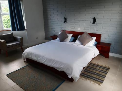 Ένα ή περισσότερα κρεβάτια σε δωμάτιο στο Maison casuarinahill