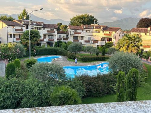a view of a resort with two swimming pools at Oasi Sole Laghi with Pool in Brebbia