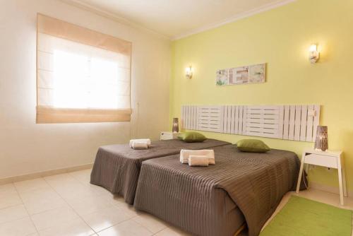 Säng eller sängar i ett rum på Apartment in Albufeira