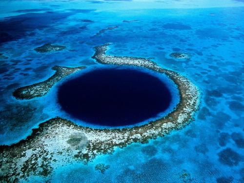 a large blue hole in the ocean at Costa Nube in Caye Caulker