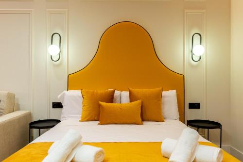 Кровать или кровати в номере Apartamentos Alvarado 5