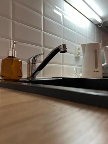 Kuchyň nebo kuchyňský kout v ubytování Apartamenty Sikorskiego 200 m od plaży