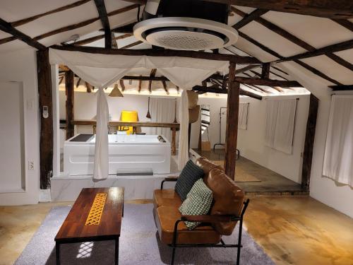 a living room with a couch and a table at Green Casa in Seogwipo