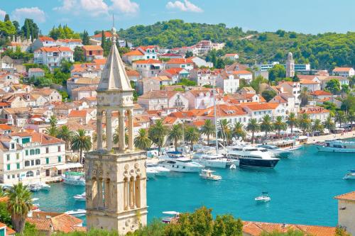 a city with boats in the water and a harbor at San Francis in Hvar