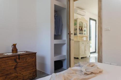 Postel nebo postele na pokoji v ubytování Villa Aura d`Olivo by Perle di Puglia