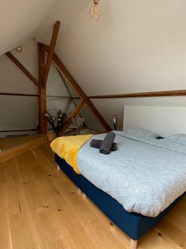 a bedroom with a bed in a attic at "LE COCON" en HYPERCENTRE PARKING GRATUIT in Amiens