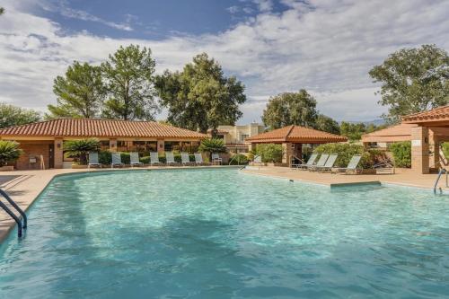 a large swimming pool with blue water at Quiet Serenity Retreat in Tucson