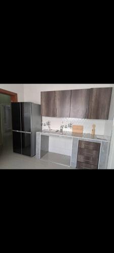a kitchen with a sink and a counter top at Edmut apartments in Lusaka