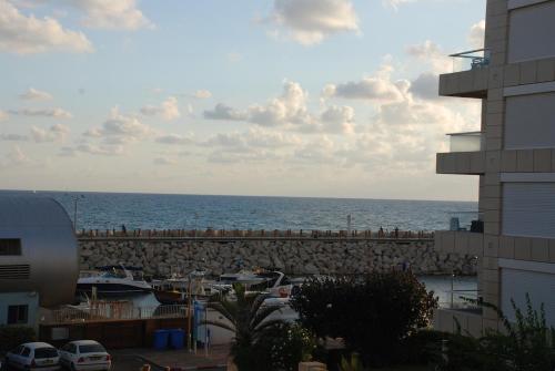 a view of the ocean from a building at Holiday luxury suite Herzliya marin see view in Herzliyya B