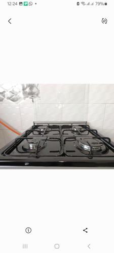 a stove top in a kitchen with a white background at Edmut apartments in Lusaka
