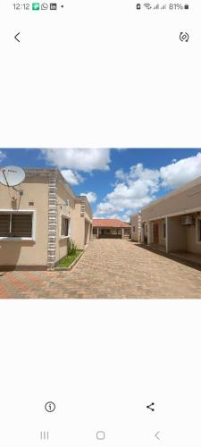 two pictures of a house and a driveway at Edmut apartments in Lusaka