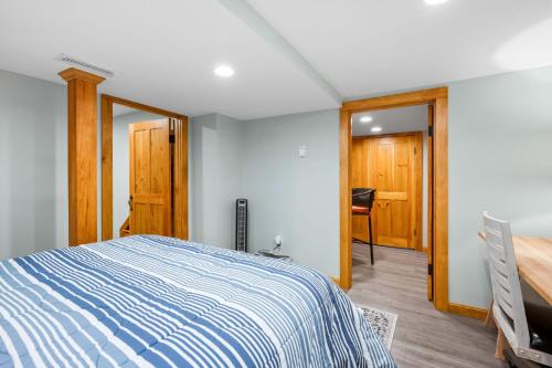 a bedroom with a bed and a desk and a chair at 57 Wood Avenue Sandwich - - Cape Cod in Sandwich
