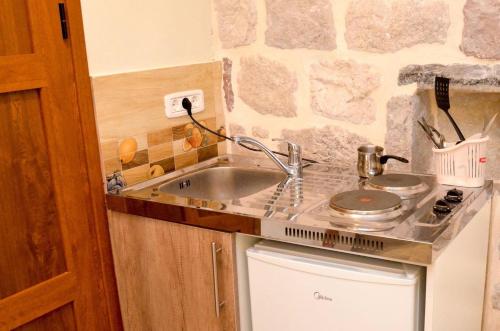 Kuchyň nebo kuchyňský kout v ubytování Apartmani Katuric-centar