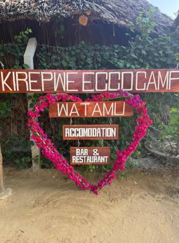 a sign with a heart made out of flowers at Kirepwe Ecco Camp Watamu in Watamu