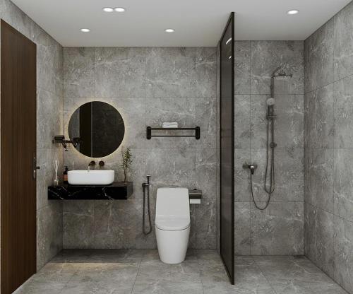 a bathroom with a shower and a toilet and a sink at Sunrise Mountain View Resort in Vang Vieng
