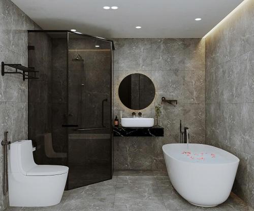 a bathroom with a tub and a shower and a sink at Sunrise Mountain View Resort in Vang Vieng