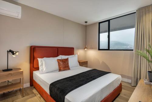 Ein Bett oder Betten in einem Zimmer der Unterkunft Apartamentos Go Living & Suites by HOUSY HOST