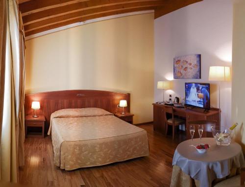 Postel nebo postele na pokoji v ubytování Hotel Purlilium