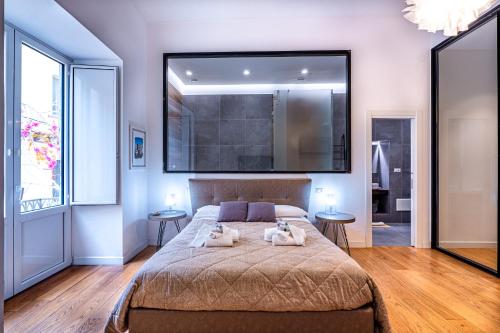 a bedroom with two dogs laying on a bed at La dimora del barone in Salerno