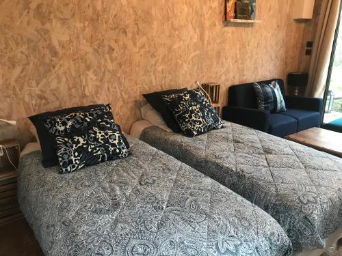 Ένα ή περισσότερα κρεβάτια σε δωμάτιο στο La cabane à cheval