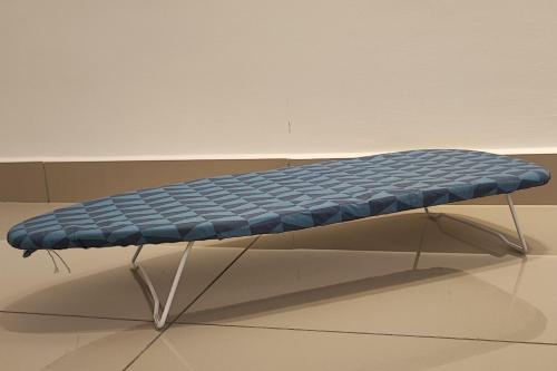 a blue bench sitting in a room at Luxury Pool at M-Luna by HCK in Kuala Lumpur