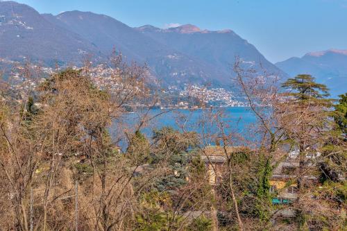 a view of a lake with mountains in the background at La Torretta by Comorooms in Como