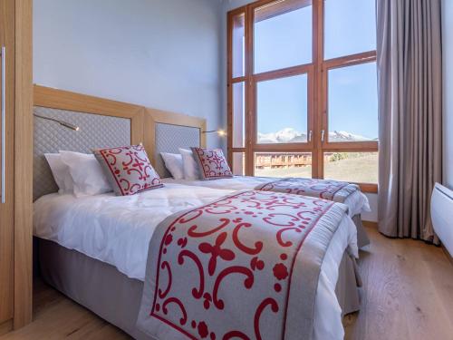 Katil atau katil-katil dalam bilik di Superbe apt 4 pièces avec piscine, spa, salle de fitness, parking et WIFI inclus aux Arcs 1800 - FR-1-352-45