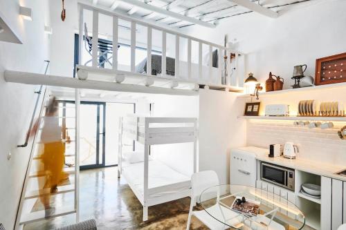a room with a loft bed and a desk at Casa Chafariz - Casas da Amieira in Amieira