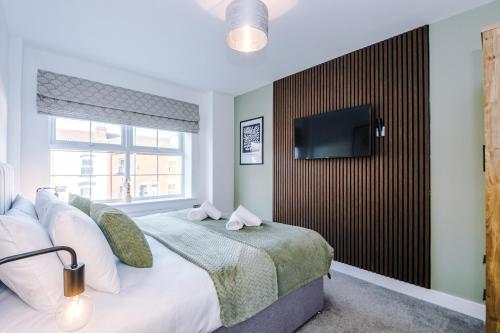 Ένα ή περισσότερα κρεβάτια σε δωμάτιο στο 4 Bed House-2 Parking spaces-Vibrant location
