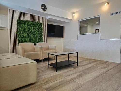 TV a/nebo společenská místnost v ubytování Hotel Velis