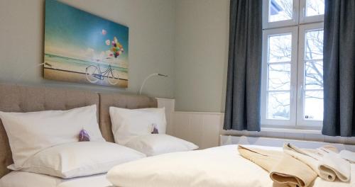 Ein Bett oder Betten in einem Zimmer der Unterkunft Strandvillen Heringsdorf