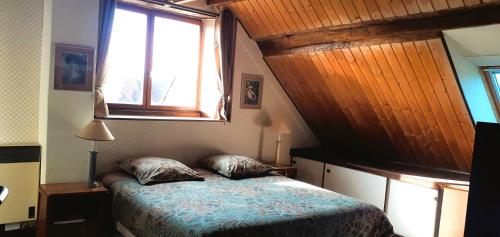 Postel nebo postele na pokoji v ubytování Au verger de Marcilly