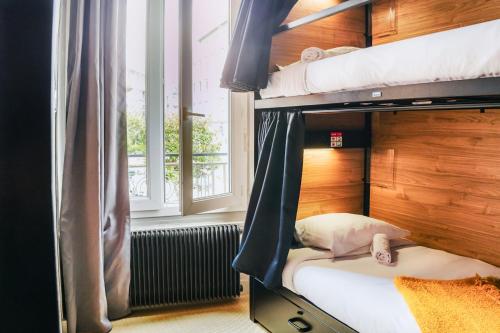 Voodi või voodid majutusasutuse HO36 Hostel Lyon toas