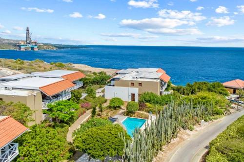 an aerial view of a house and the ocean at Boca Gentil Bayside 10 in Jan Thiel