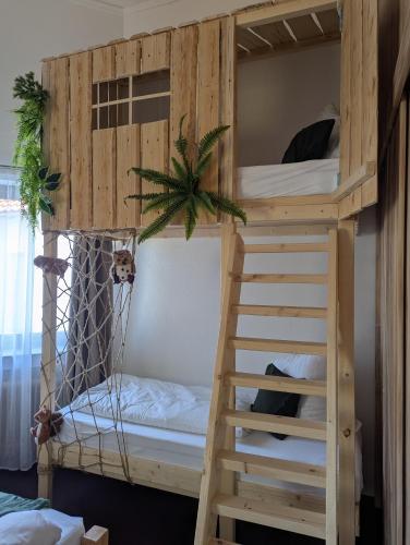 Postel nebo postele na pokoji v ubytování Baumhaus Suite