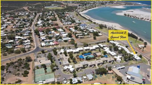 an aerial view of a parking lot next to a beach at Riverview Holiday Apartment 3 - Kalbarri WA in Kalbarri
