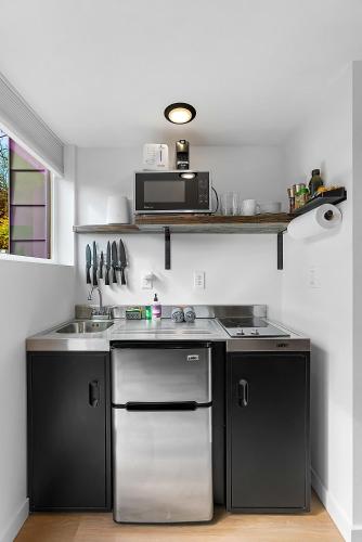 Η κουζίνα ή μικρή κουζίνα στο Sleek & Stylish Urban Loft